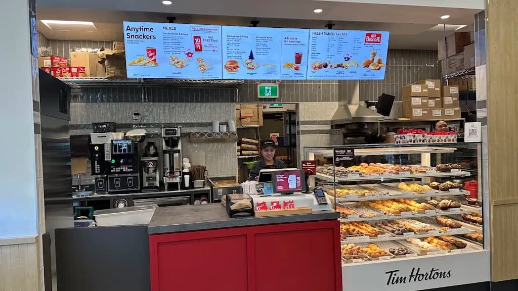Tim Hortons storefront and interior at 100 Walden Gate, Calgary, AB