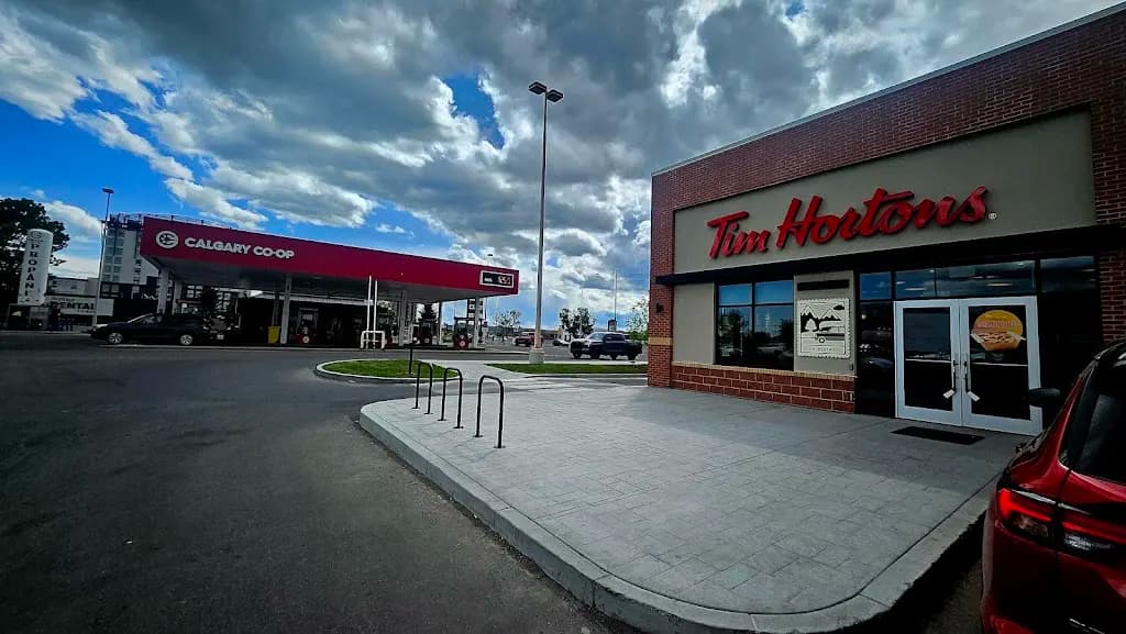 Tim Hortons storefront and interior at 130 - 8810 Macleod Trl Se, Calgary, AB