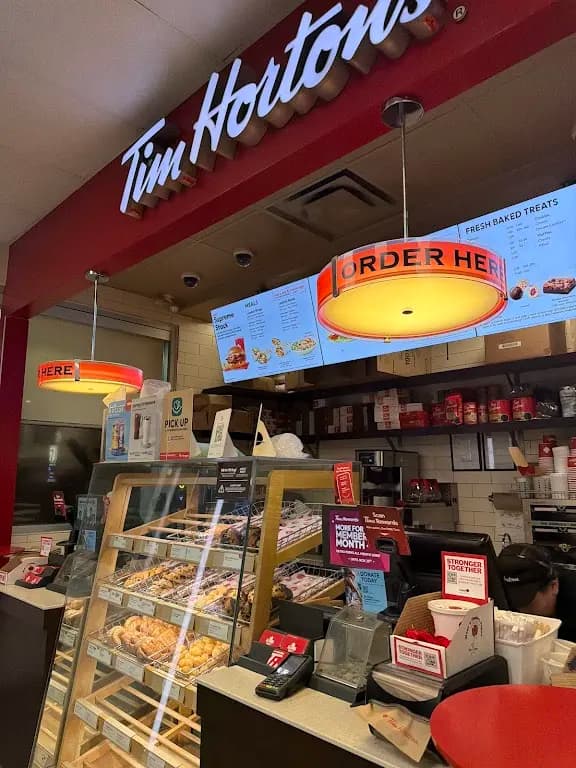 Tim Hortons storefront and interior at 15150 Mount Mckenzie Dr Se, Calgary, AB