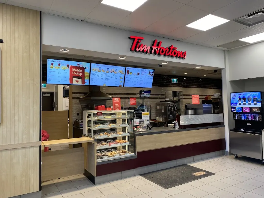 Tim Hortons storefront and interior at 40 Midlake Blvd Se, Calgary, AB