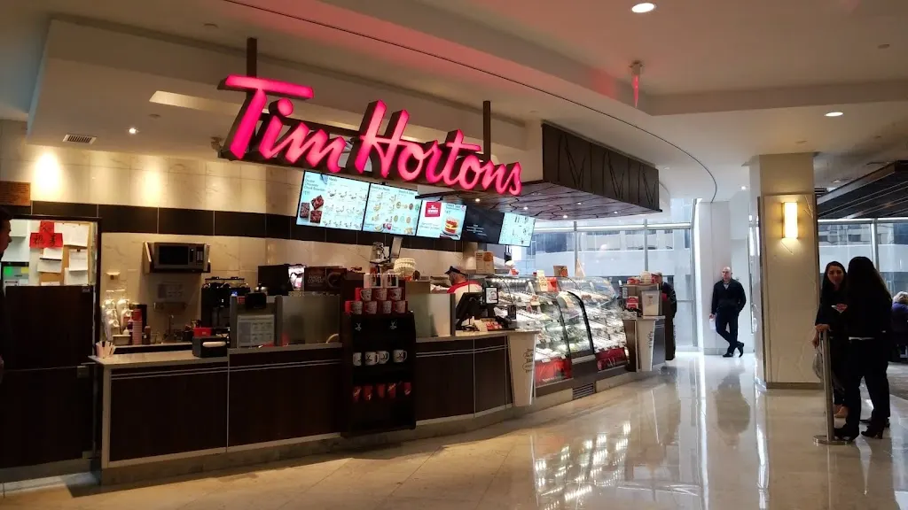 Tim Hortons storefront and interior at 240 4 Ave Sw, Calgary, AB