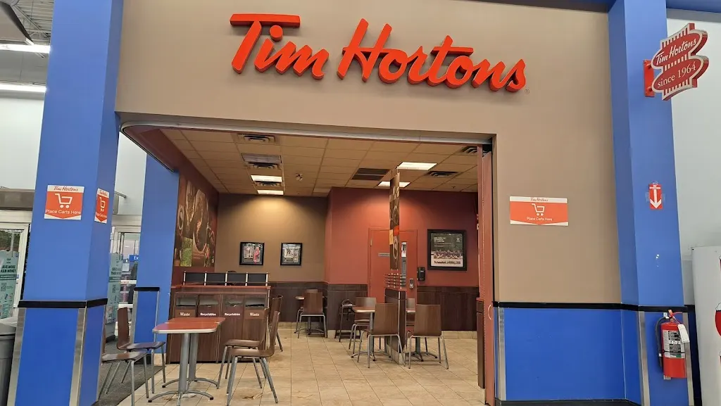 Tim Hortons storefront and interior at 255 East Hills Blvd Se, Calgary, AB