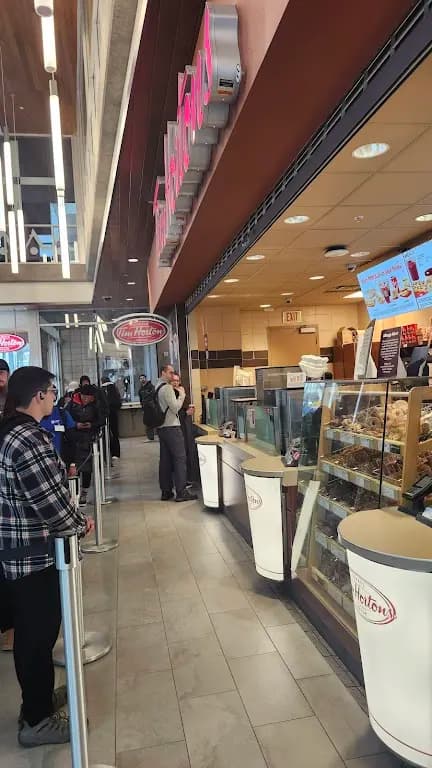 Tim Hortons storefront and interior at 345 6th Ave Se, Calgary, AB