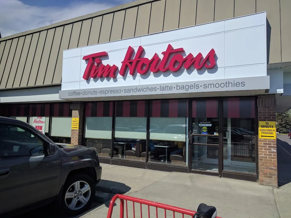 Tim Hortons storefront and interior at 2525 Woodview Dr Sw, Calgary, AB
