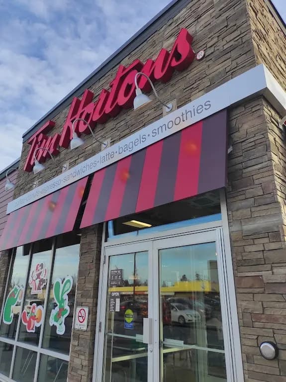 Tim Hortons storefront and interior at 4750 17th Ave Se, Calgary, AB