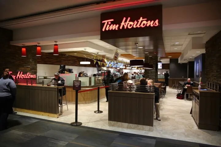 Tim Hortons storefront and interior at 1000 Airport Road, Edmonton, AB