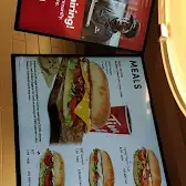 Tim Hortons storefront and interior at 60 Rivermont Rd, Brampton, ON