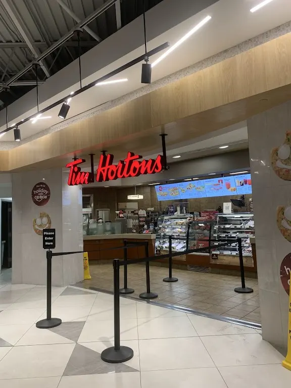 Tim Hortons storefront and interior at 1 Water St East, Cornwall, ON