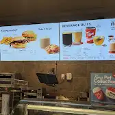 Tim Hortons storefront and interior at 1 Water St East, Cornwall, ON