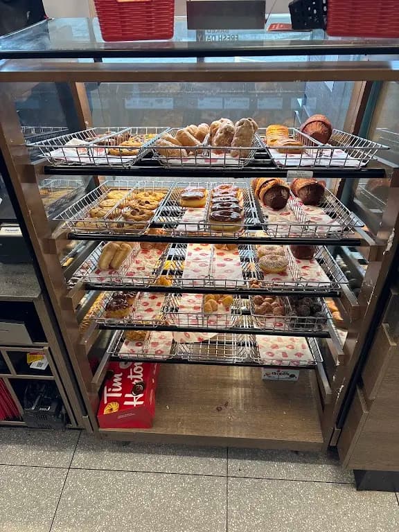 Tim Hortons storefront and interior at 1622 Roger Stevens Dr., Kars, ON