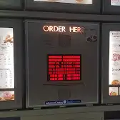 Tim Hortons storefront and interior at 780 South Sheridan Way, Mississauga, ON