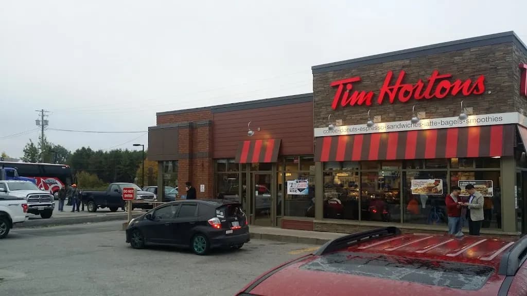 Tim Hortons storefront and interior at 82 Front St, Sturgeon Falls, ON