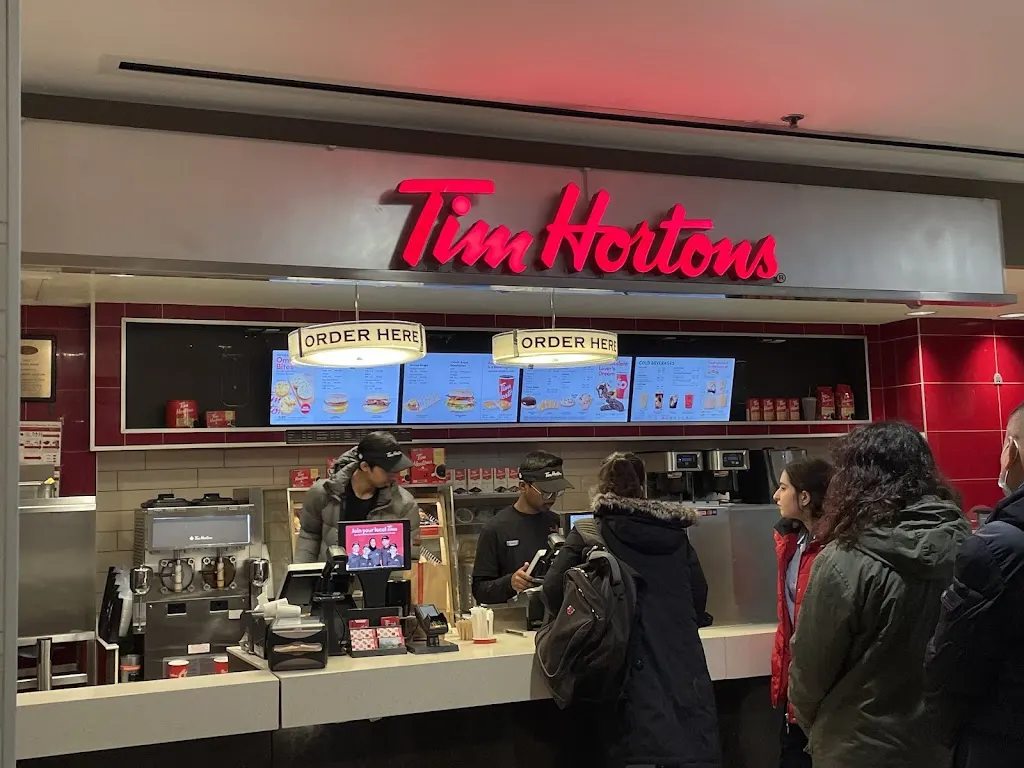 Tim Hortons storefront and interior at 2 Bloor St E, Toronto, ON