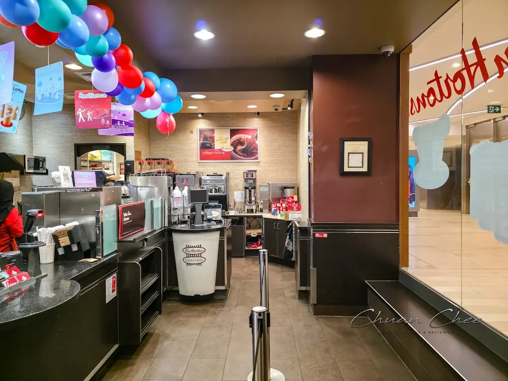 Tim Hortons storefront and interior at 50 Bloor St West, Toronto, ON