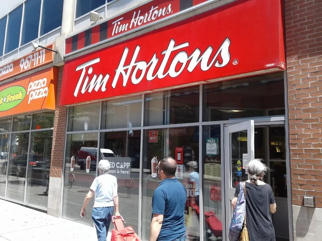 Tim Hortons storefront and interior at 55 St Clair Ave W, Toronto, ON