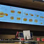 Tim Hortons storefront and interior at 55 York St, Toronto, ON