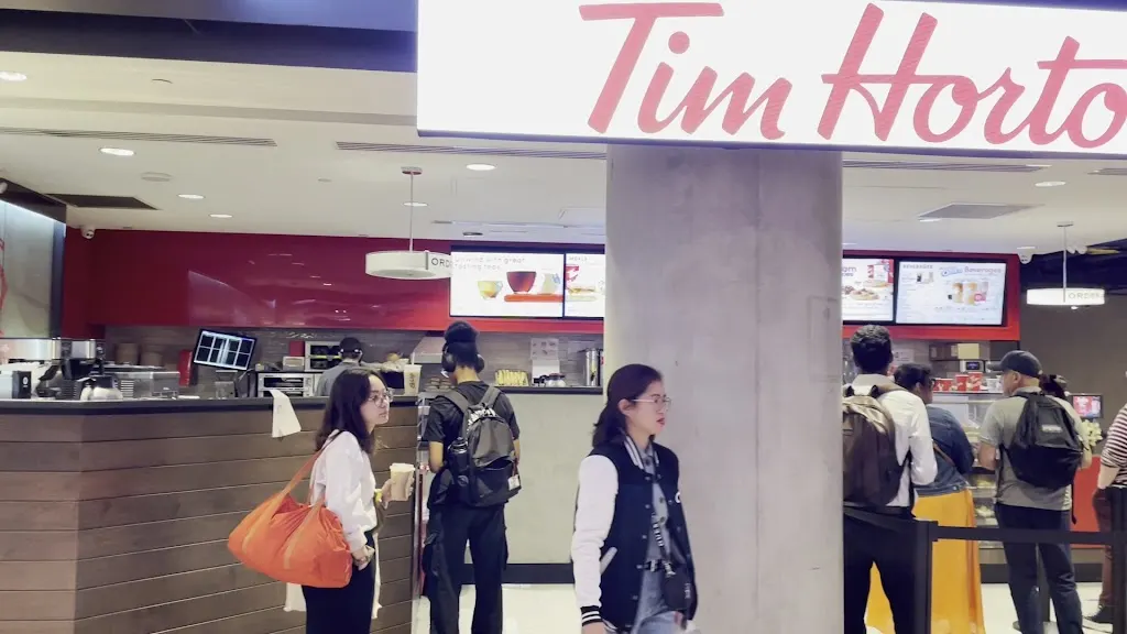 Tim Hortons storefront and interior at 65 Front Str. W, Toronto, ON