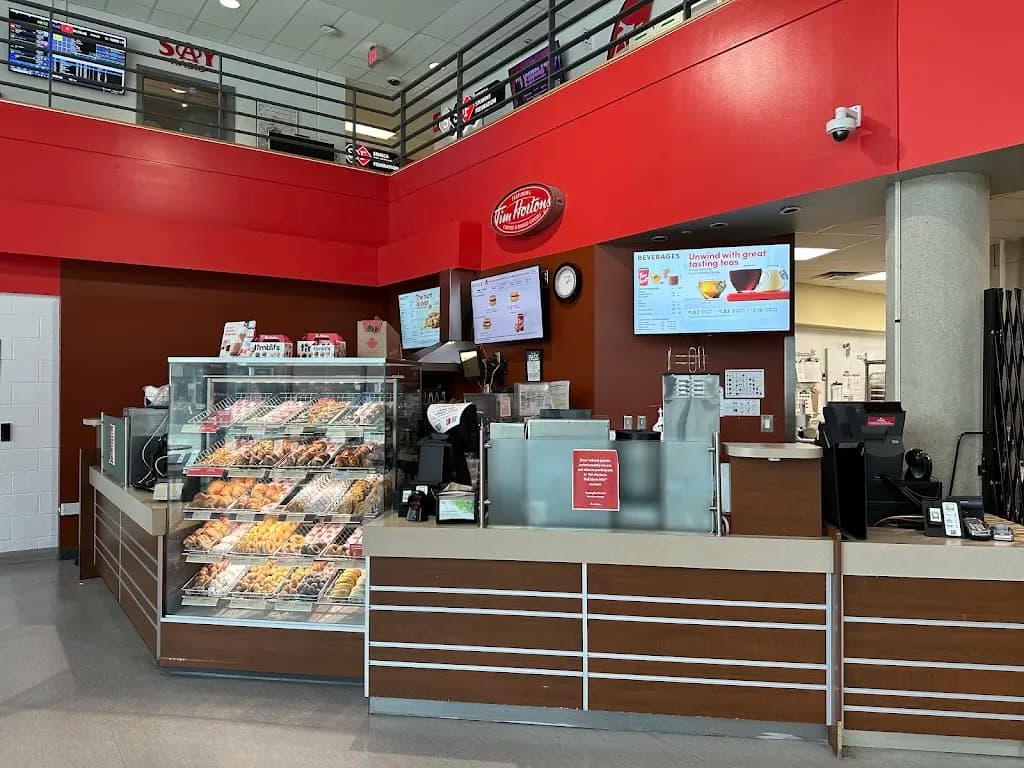 Tim Hortons storefront and interior at 70 The Pond Rd, Toronto, ON