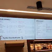 Tim Hortons storefront and interior at 100 King St West, Toronto, ON