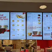 Tim Hortons storefront and interior at 111 Carlton St, Toronto, ON
