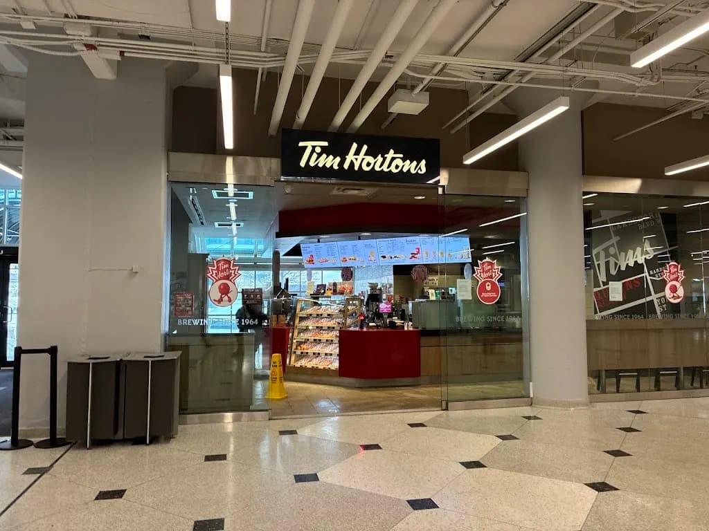 Tim Hortons storefront and interior at 207 Queens Quay, Toronto, ON