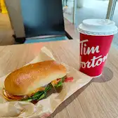 Tim Hortons storefront and interior at 249 Queens Quay West, Toronto, ON