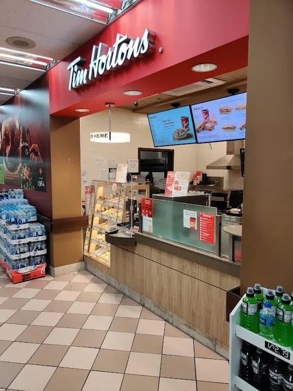 Tim Hortons storefront and interior at 256 Jarvis St, Toronto, ON