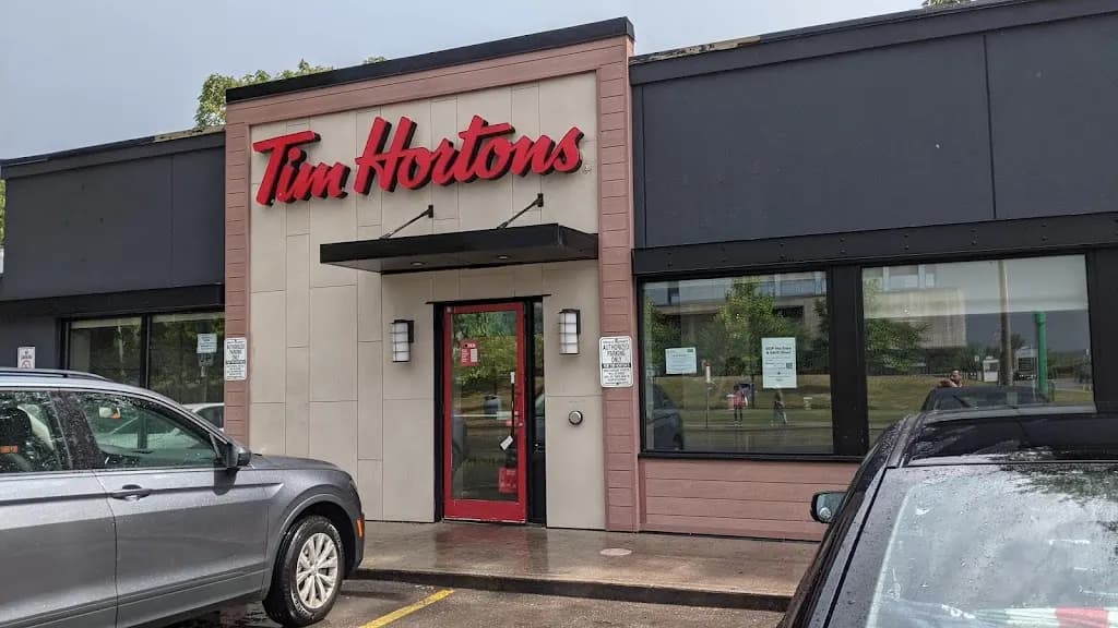 Tim Hortons storefront and interior at 547 Gerrard St East, Toronto, ON