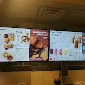 Tim Hortons storefront and interior at 720 King St West, Toronto, ON