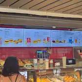 Tim Hortons storefront and interior at 1000 Gerrard St. East, Toronto, ON