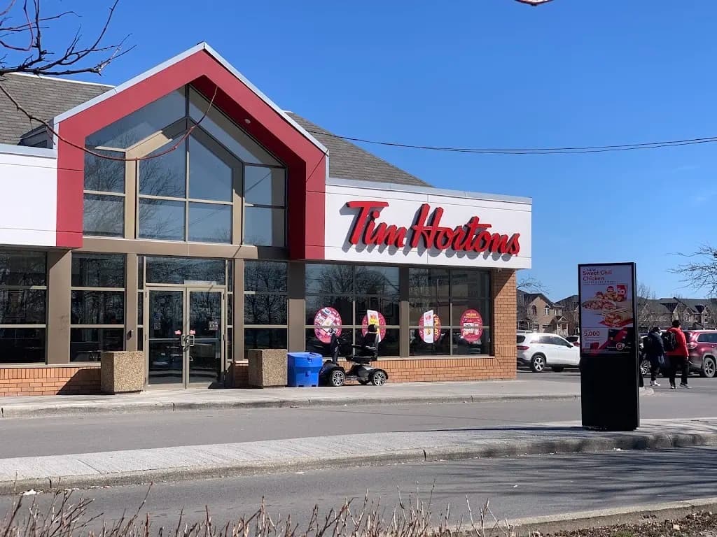 Tim Hortons storefront and interior at 9801 Jane St, Vaughan, ON