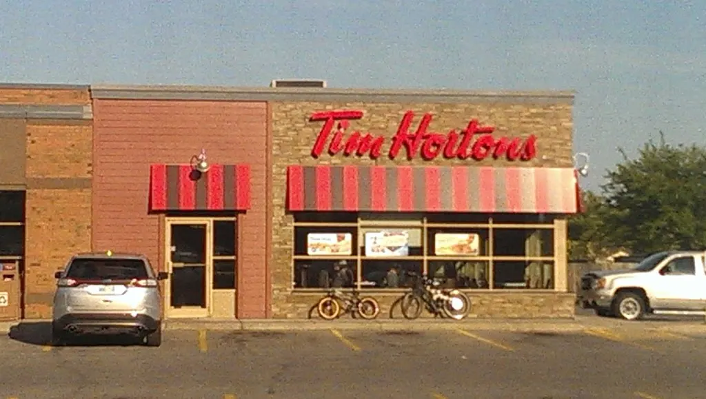 Tim Hortons storefront and interior at 30 Rice Rd, Welland, ON