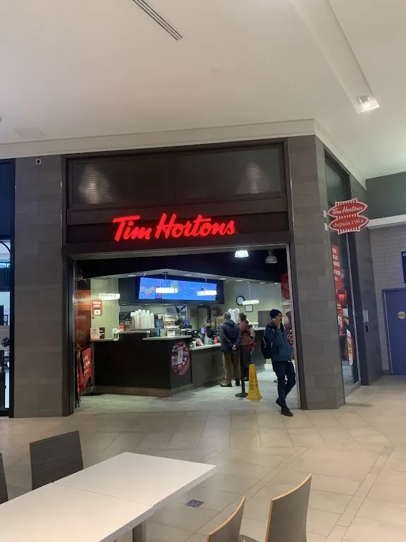 Tim Hortons storefront and interior at 3035 Blvd De Carrefour, Laval, QC
