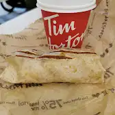 Tim Hortons storefront and interior at 3035 Blvd De Carrefour, Laval, QC